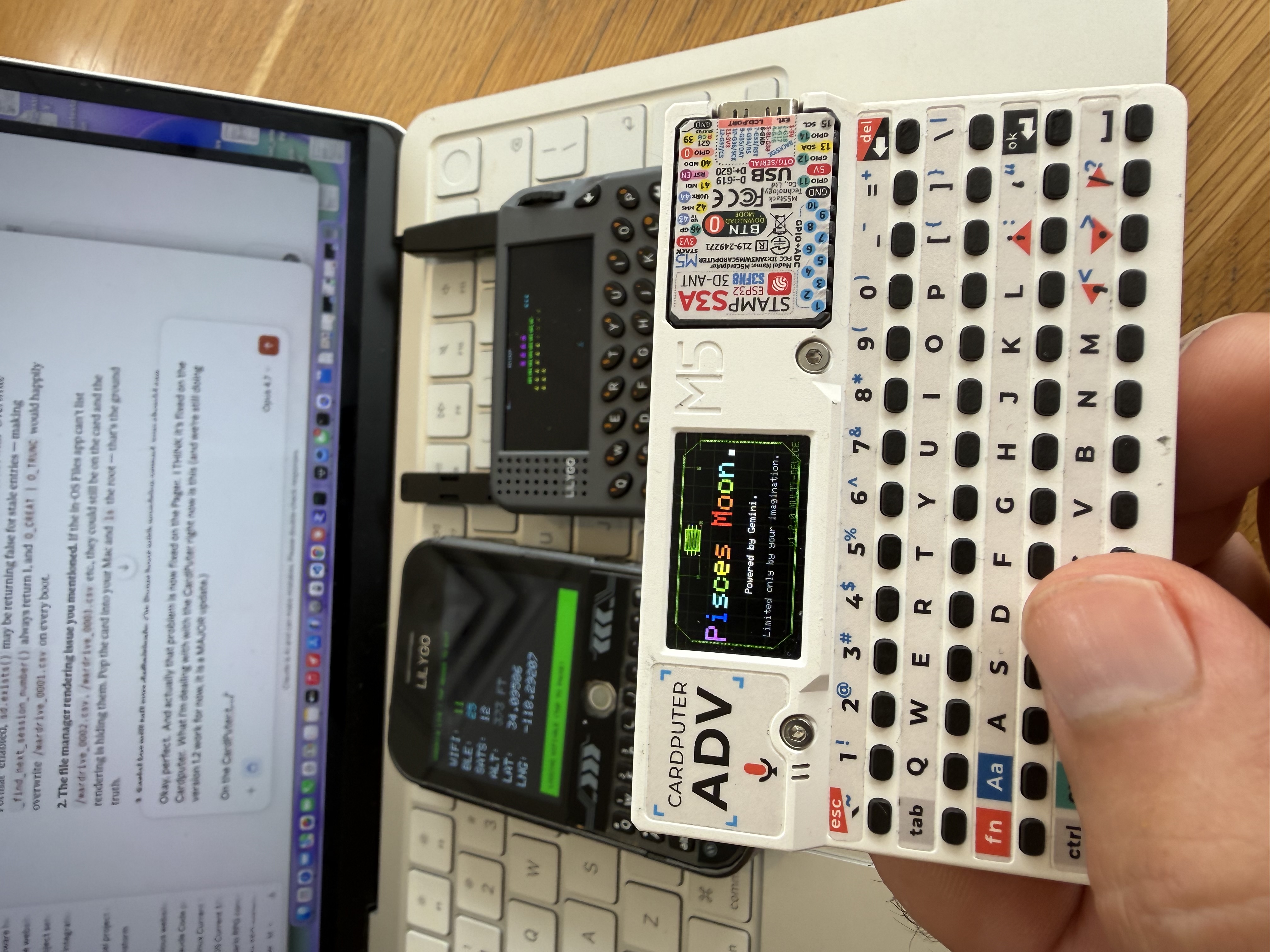 Two LilyGo devices running Pisces Moon OS simultaneously — T-Deck Plus and T-LoRa Pager — both wardriving in downtown Los Angeles, May 15, 2026